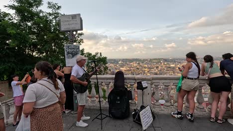 group of tourists admiring cityscape and music