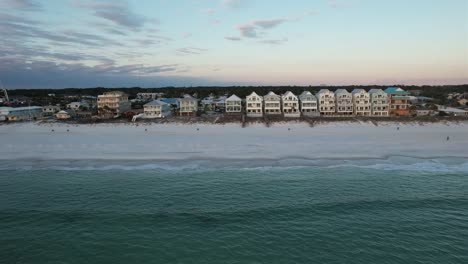 beautiful beach houses along serene waters - drone shot