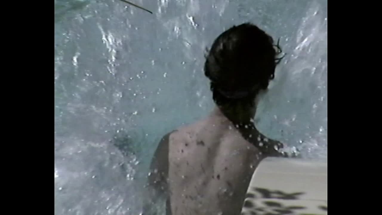 People on a waterslide at a swimming pool