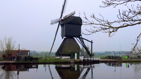 famous dutch old-fashioned windmill in kinderdijk the netherlands