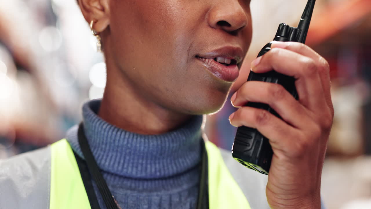 Woman working in a warehouse and talking on a radio