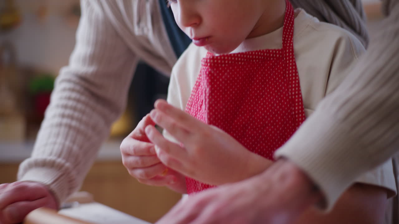 Boy Helps Dad Roll Out Dough For Dumplings