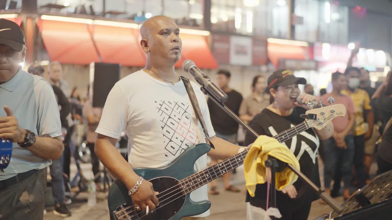 Street Performers Playing Music at Night