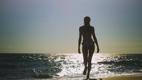 woman on beach at sunset