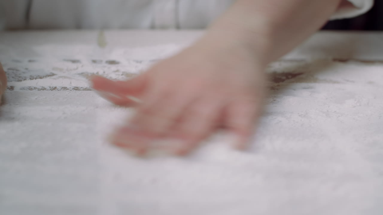 prepping countertop for pizza dough