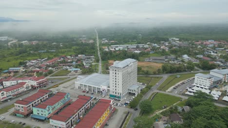 foggy morning beautiful drone view of sri aman town at batang lupar river, during regatta and pesta benak,sarawak, borneo.