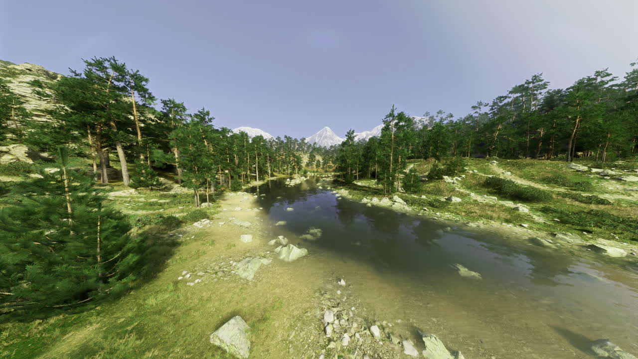 Lush green forest landscape with tranquil lake and distant mountains