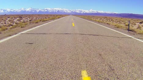 pov shot along a desert road driving fast 1