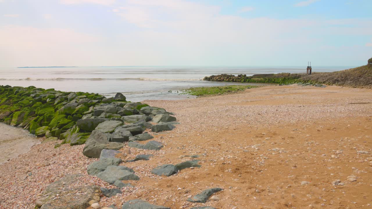 Pan shot of the beach and sea in Angoulins, France.