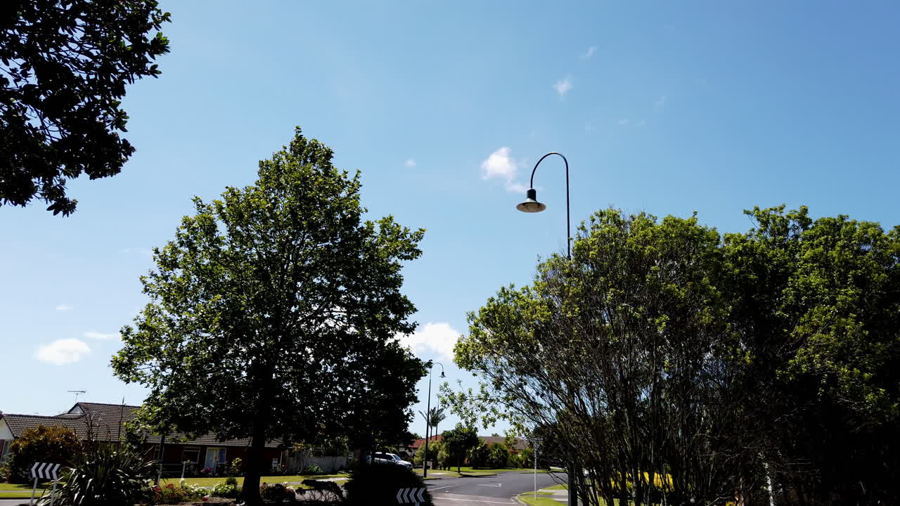 Perfect summer day in peaceful neighborhood with stunning blue sky, slow motion