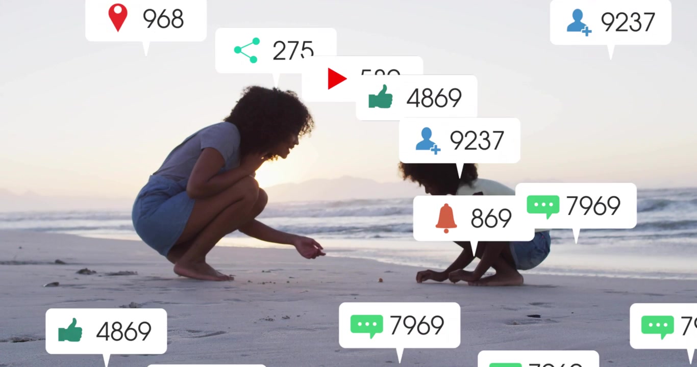 Woman and child examining sand on shore, reaching causing social bubbles multiplying then thinning