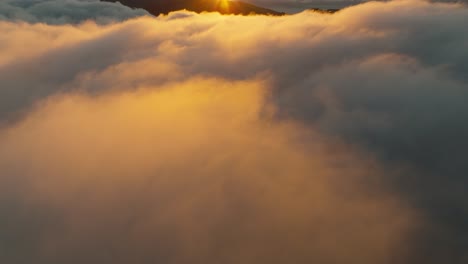 drone flight over the clouds during a sunrise in madeira portugal