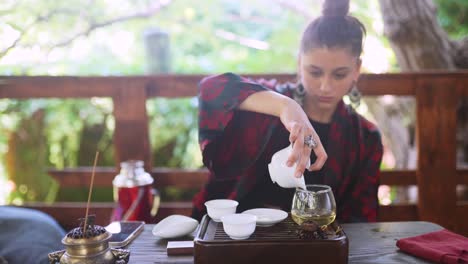 woman enjoying a tea ceremony outdoors