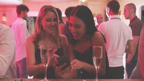 two women having fun at a nightclub