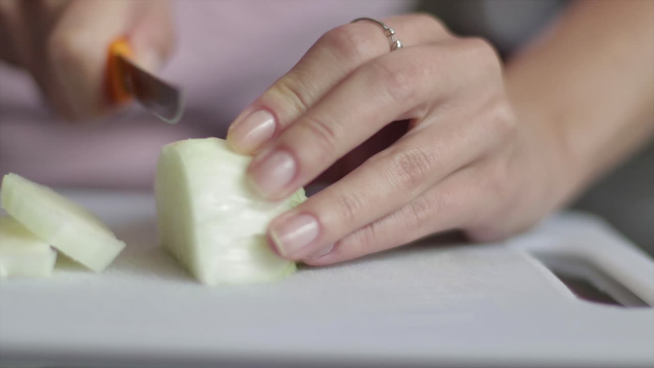 Chef slicing onions close up
