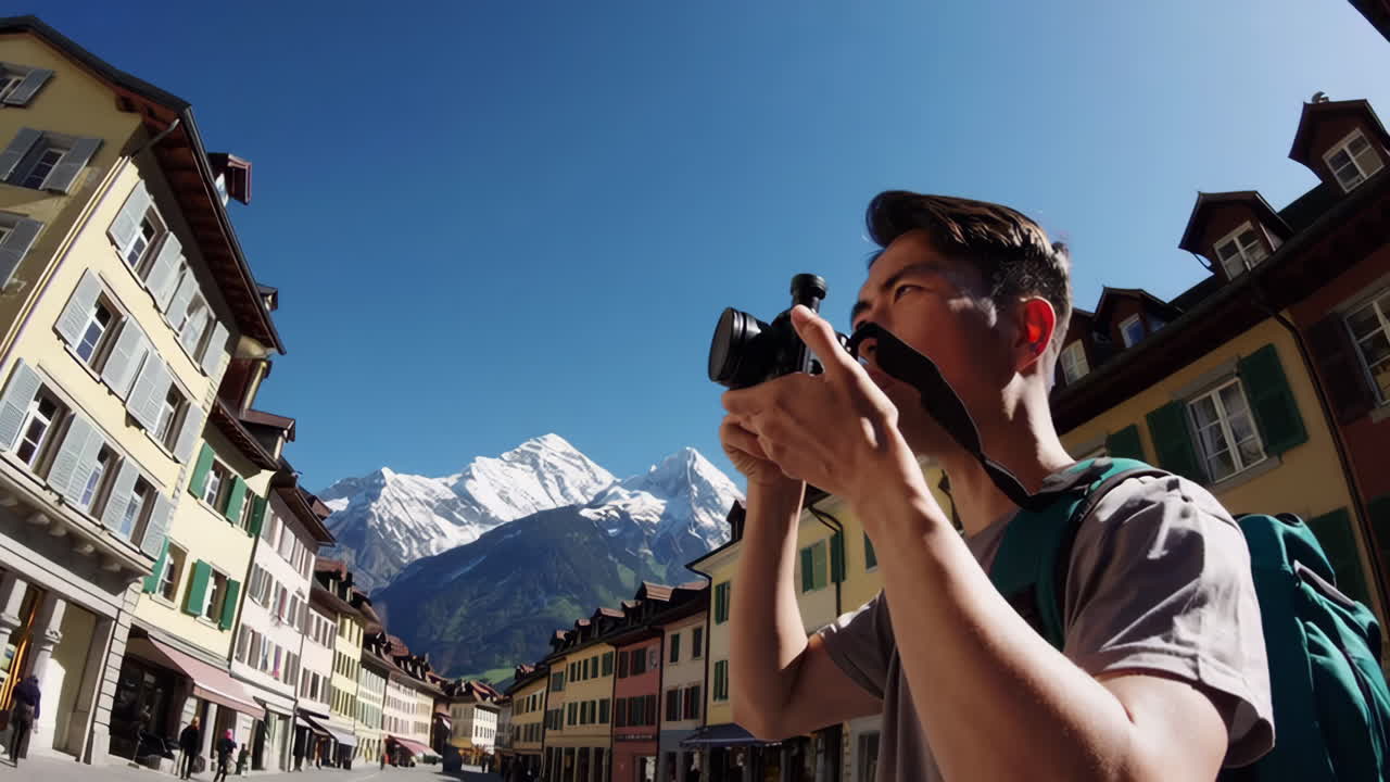 Man taking pictures in a picturesque town
