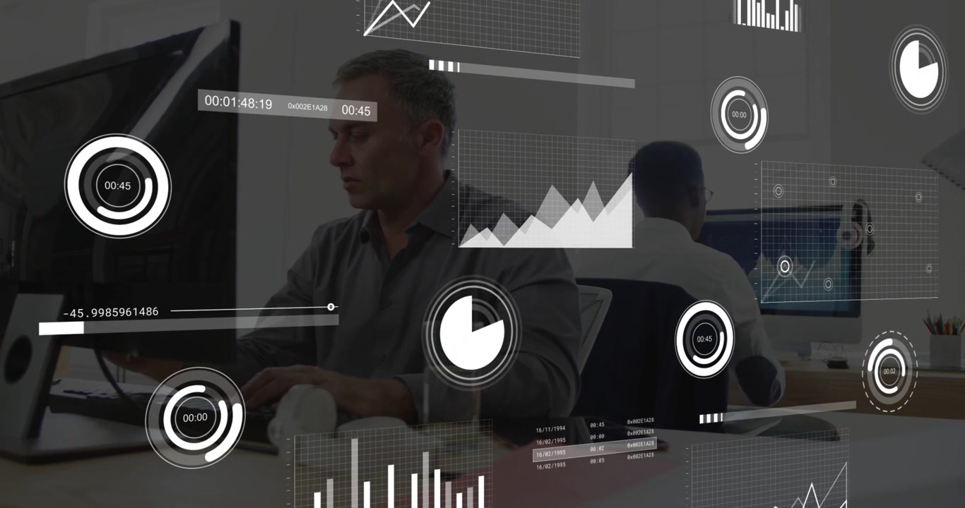 Middle-aged man typing in business, activating HUD, monitoring graphs, glancing at coworker