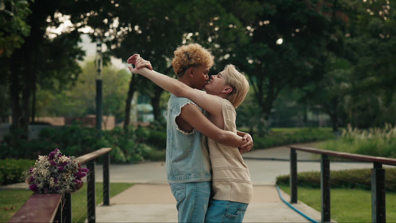 Two LGBTQ Women Embracing in a Park
