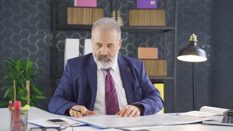 businessman working looking at paperwork files.