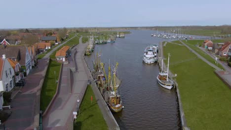 drone flight over a idyllic small fishing port in germany