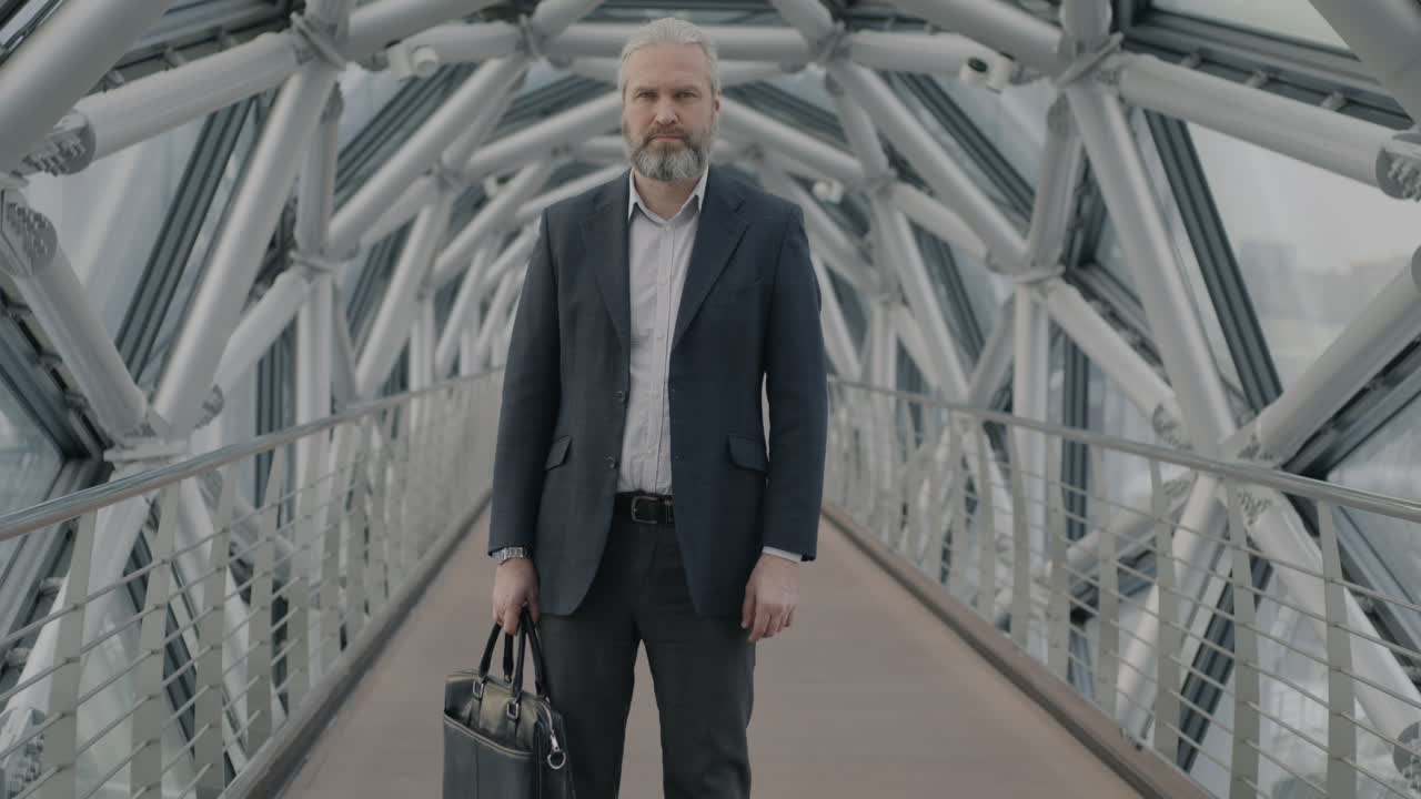 Businessman on a modern city bridge