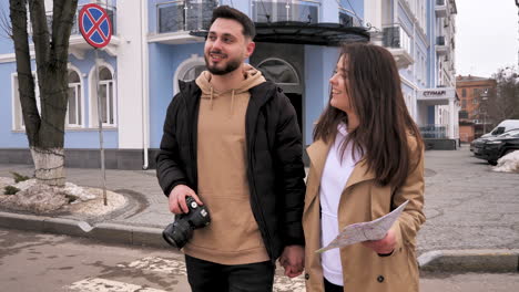 caucasian tourist couple walking through the city.