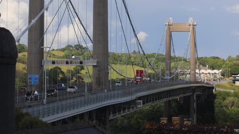 the tamar bridge over the river tamar with flowing traffic on a sunny day between devon and cornwall