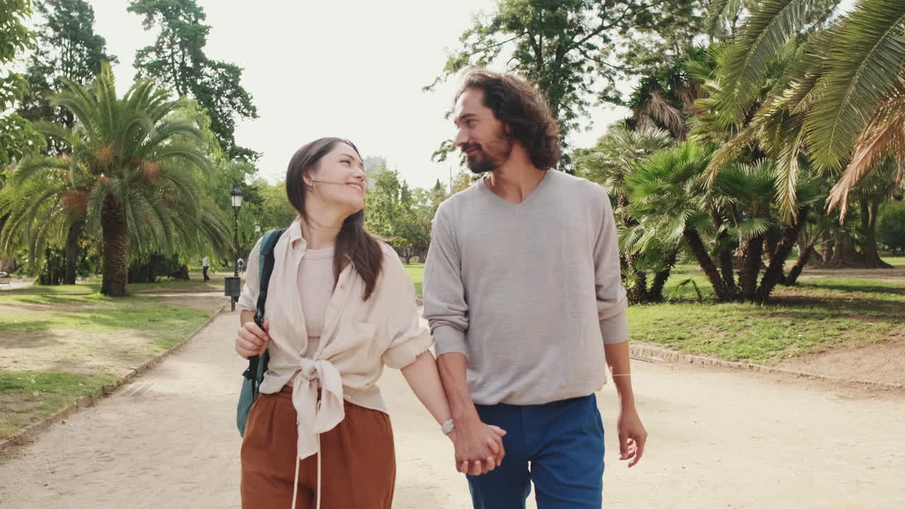 Couple walking in a park holding hands