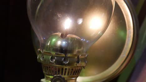 close-up tilt up over an antique oil lamp