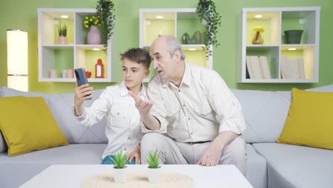 Grandfather-and-grandson-making-video-calls-with-their-parents.