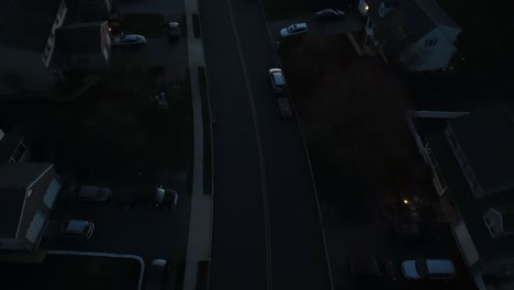 Aerial-birds-eye-shot-of-sleeping-neighborhood-at-night