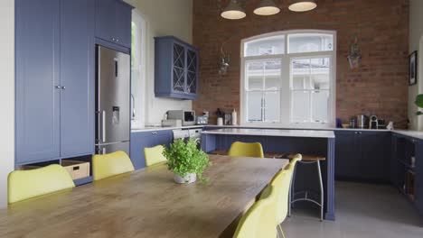 interior of open plan kitchen and dining room with table and chairs