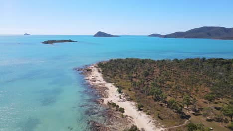 seascape with manta ray and saddleback islands from nelly bay park - dingo beach at whitsunday, qld, australia