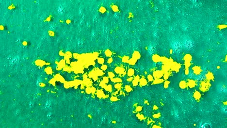 abstract green and yellow paint splatters