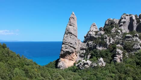 Flying-over-a-rocky-peak-and-sea