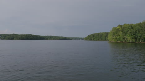 fast aerial flyover close to the water on hyco lake in north carolina