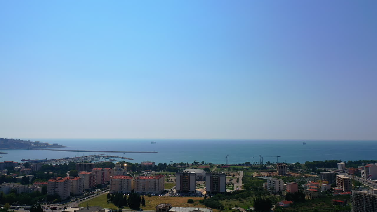 Top view panorama of sunny city of Bar in Montenegro. Splendid scenery of the Adriatic Sea at backdrop.