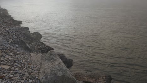 foggy sunrise on the norfork river near mountain home arkansas usa river rocks and flowing river