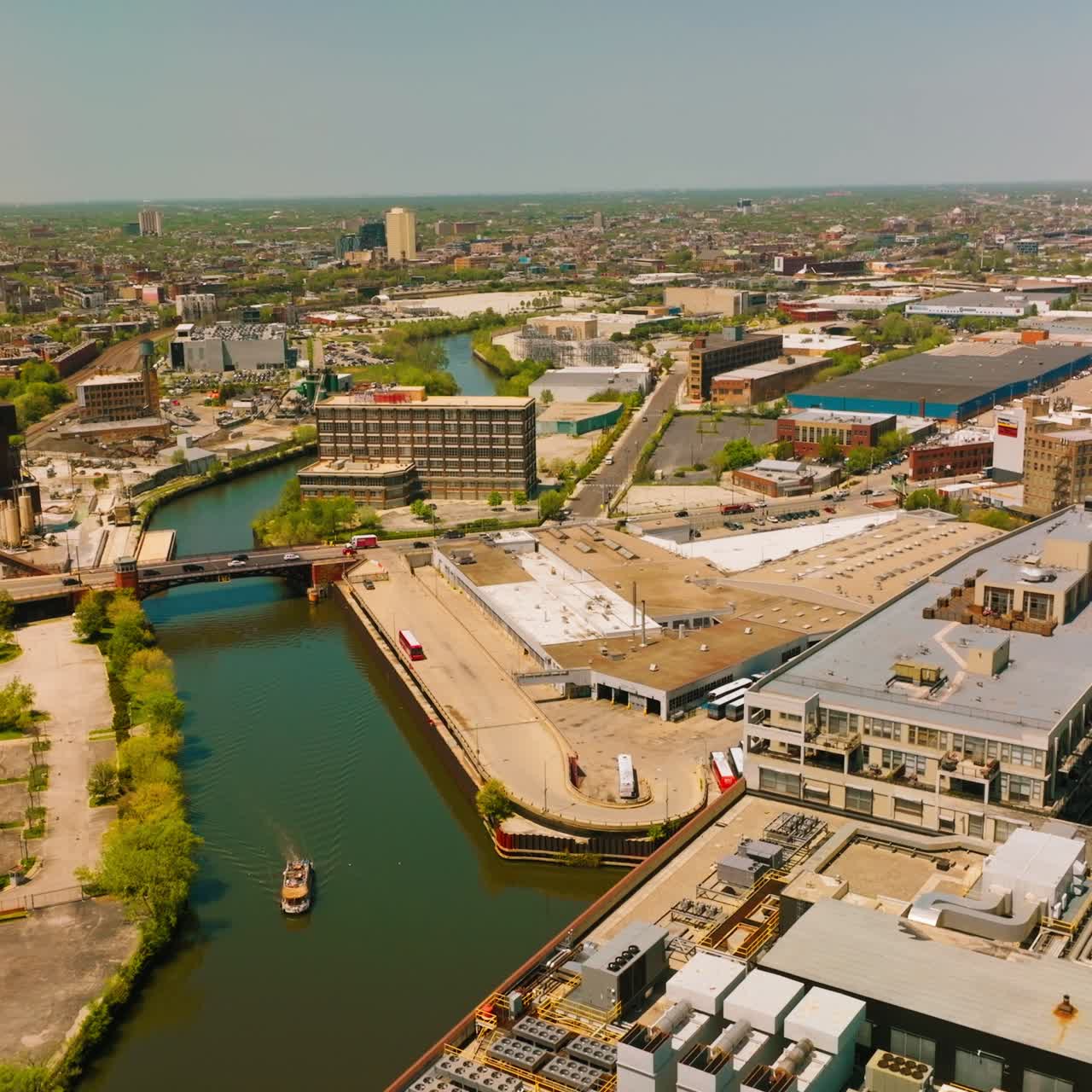 The Chicago River flowing through the big city. Amazing city panorama on sunny day at the backdrop of blue sky