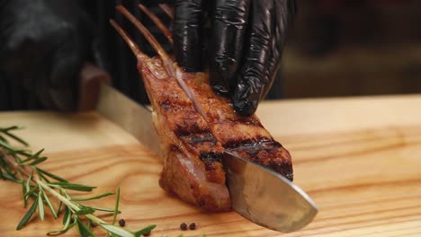 chef cutting grilled lamb chops