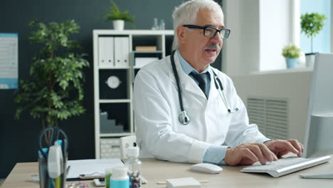 doctor working on computer in office