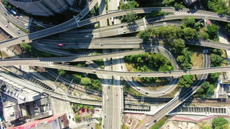 time lapse of a massive highway interchange with traffic on all levels in downtown hong kong, aerial view