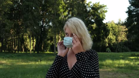 Beautiful-girl-wears-a-mask-near-the-trees-in-the-park