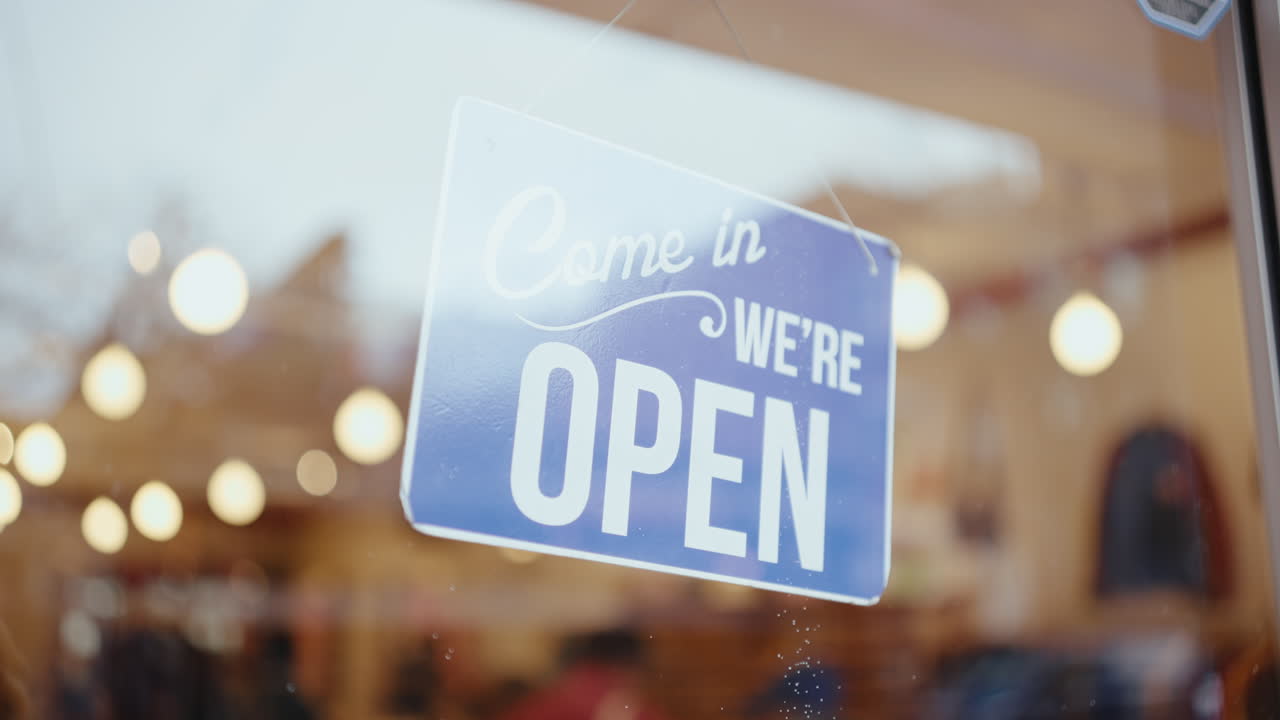 Open for Business Sign in Store Window