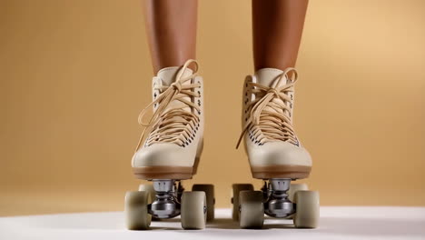 close-up of legs in vintage roller skates