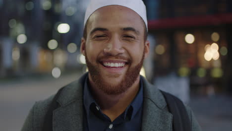 close up portrait of young muslim man commuter smiling happy enjoying urban travel in city