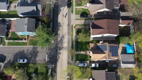 A-top-down-shot-taken-over-a-quiet-suburban-neighborhood-on-a-sunny-day