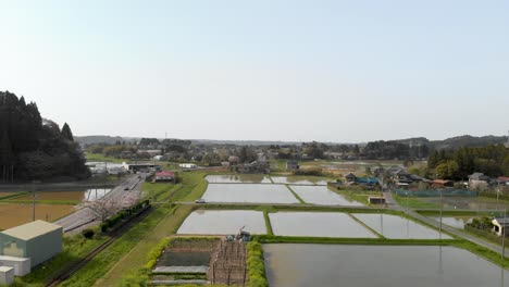 calm and relaxing aerial drone footage of rural japan with water rice fields