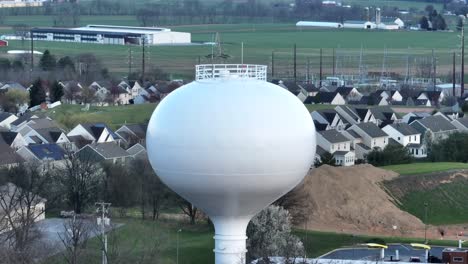 water tower in american neighborhood town in winter