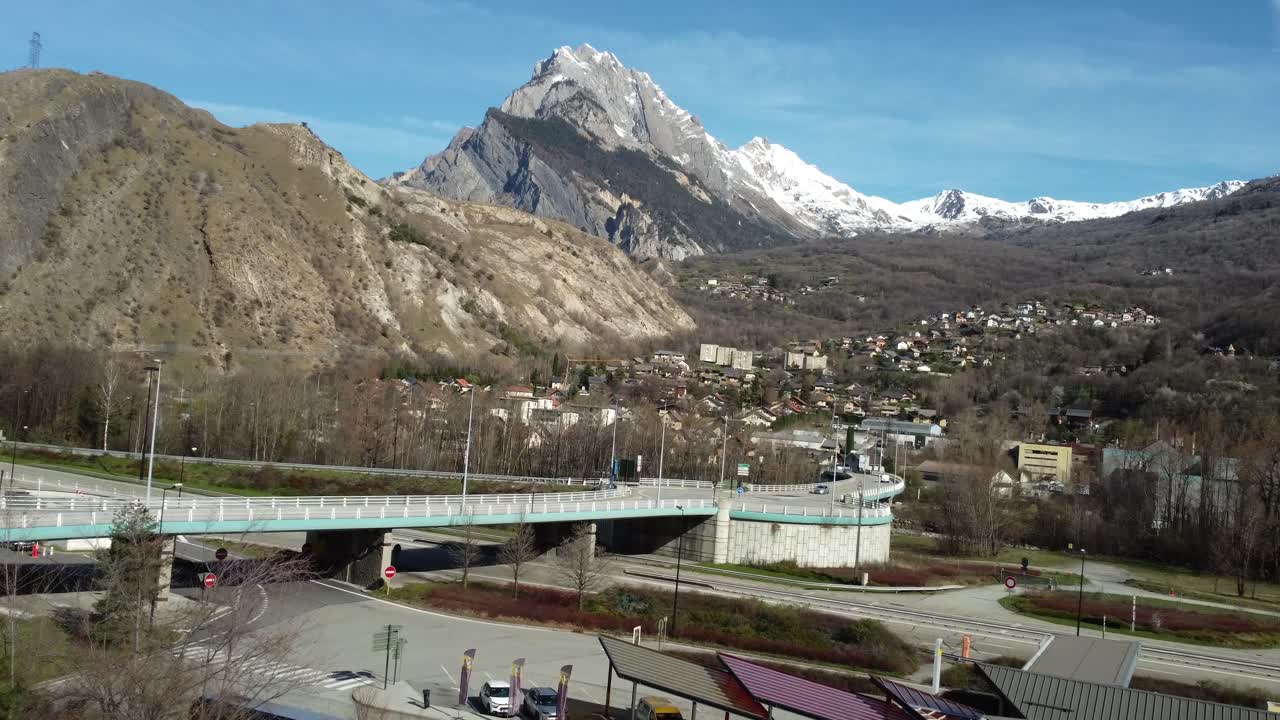 Scenic View of the Alps with a Bridge